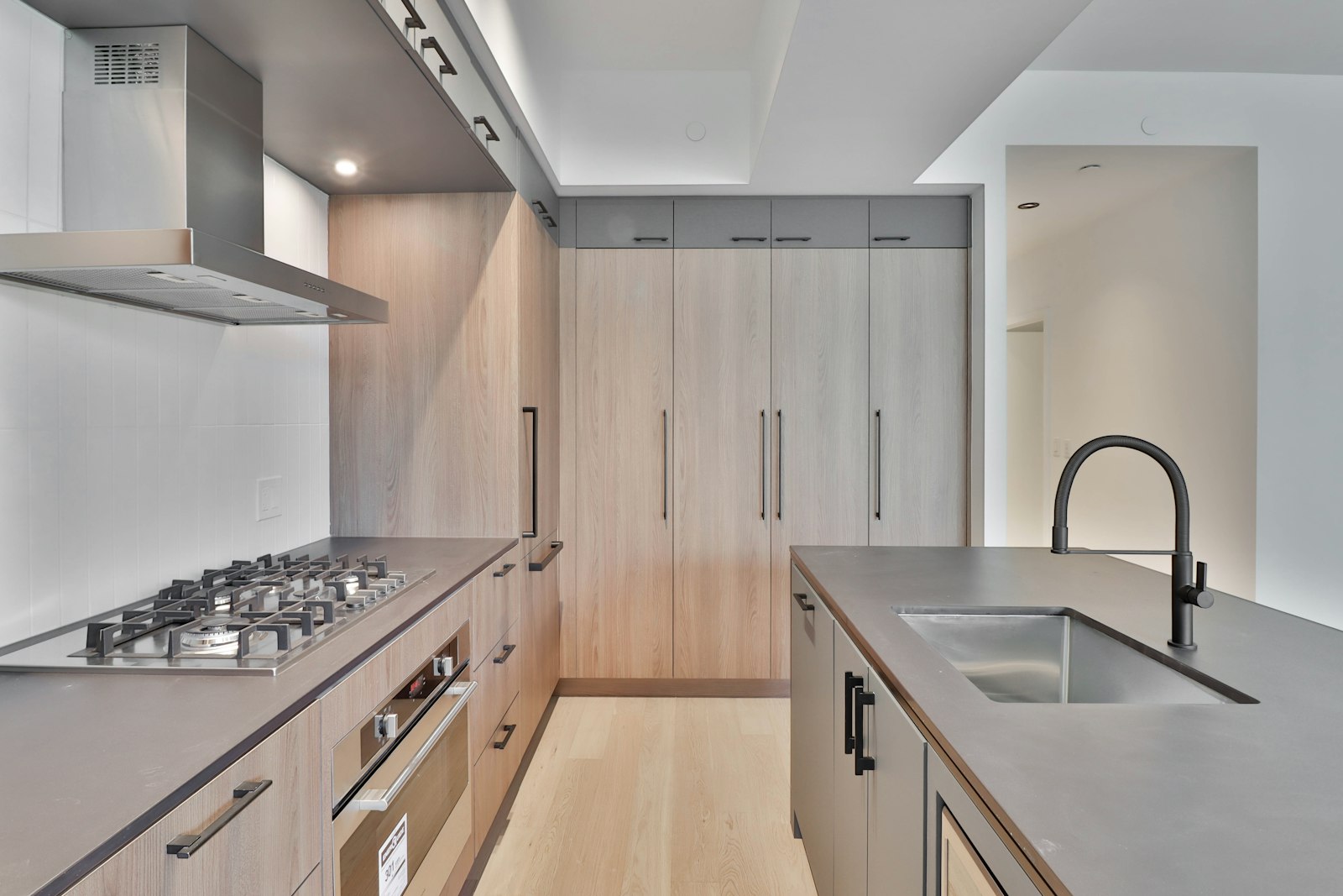 Modern kitchen with island and designer lighting